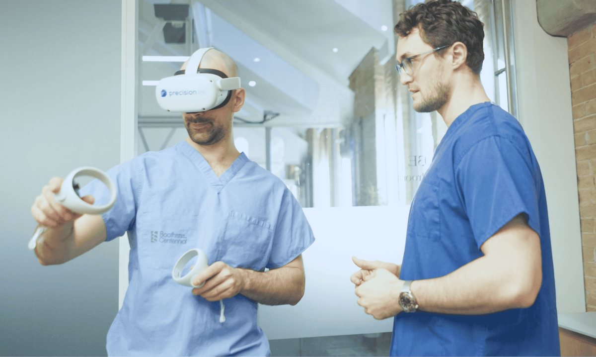 Two clinicians using PrecisionOS for VR surgical training, from PrecisionOS’s official website