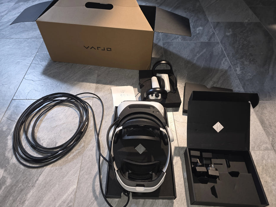 Pre-owned Varjo XR-4 Focal Edition complete kit with headset, controllers, cables, adapters, and original box